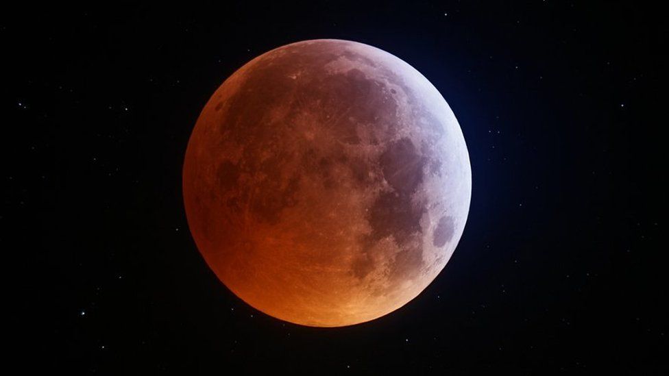 Stars shining around the Moon during lunar eclipse