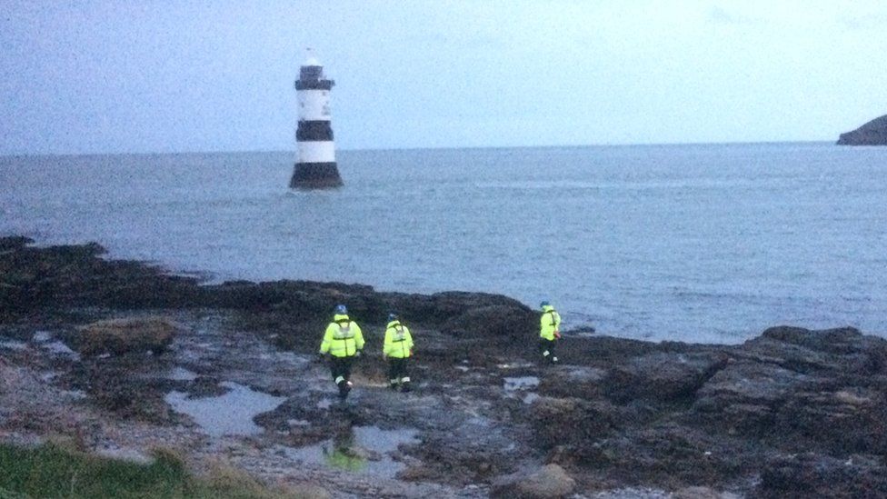 Coastguard volunteers begin searching the coast at Penmon