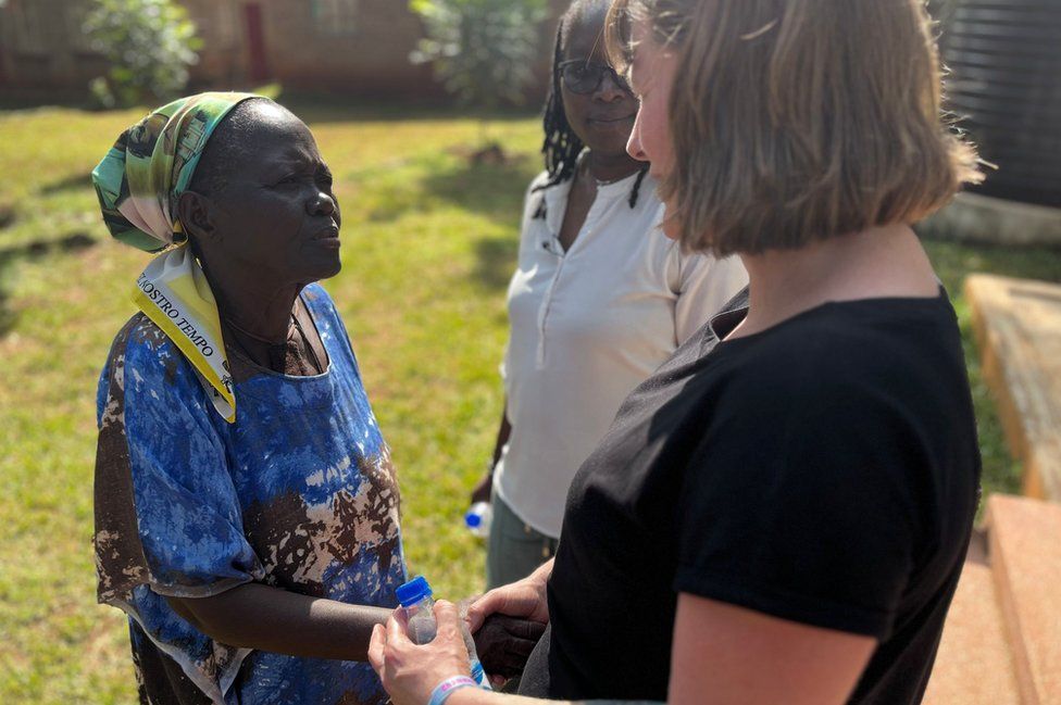 Three women talk to each other