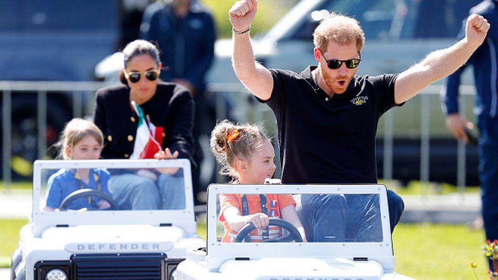 Prince Harry was driven in a miniature car by four-year-old Dutch girl Scarlet Vroegop