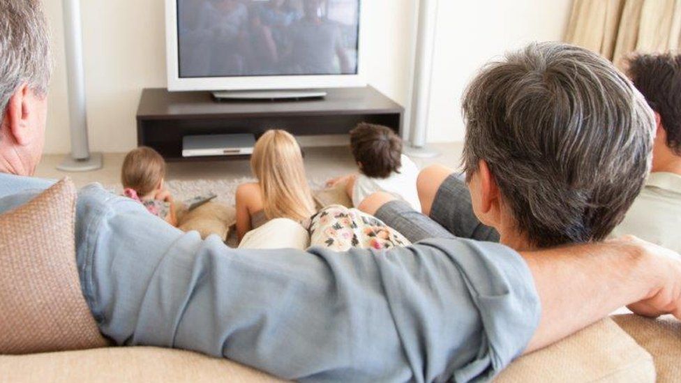 Large family watch tv
