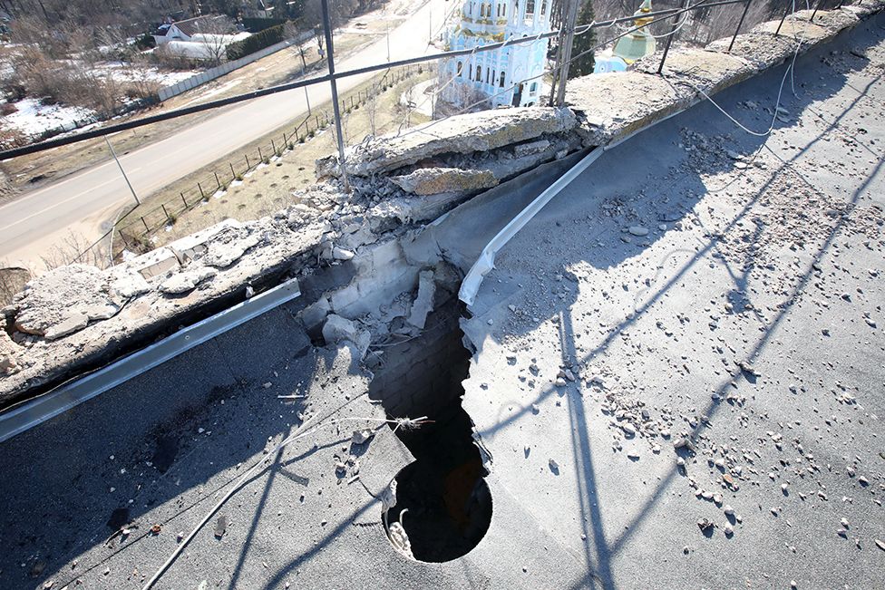 A bomb-damaged road caused by Russian troops in a residential area in Piatykhatky, Kharkiv, north-eastern Ukraine