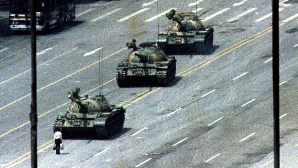 A man known as "tank man" stands in front of tanks in 1989