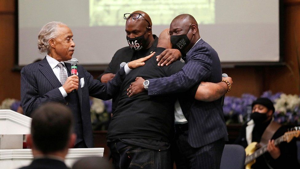 Terrence Floyd, brother of George Floyd, is comforted by Rev Al Sharpton (L), his brother Philonise Floyd, and attorney Ben Crump (R), during a prayer vigil the day before opening statements in the trial of former police officer Derek Chauvin, who is facing murder charges in the death of George Floyd, in Minneapolis, Minnesota, on 28 March 2021