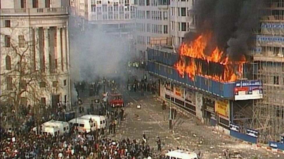 Building set ablaze in Trafalgar Square during 1990 poll tax riots