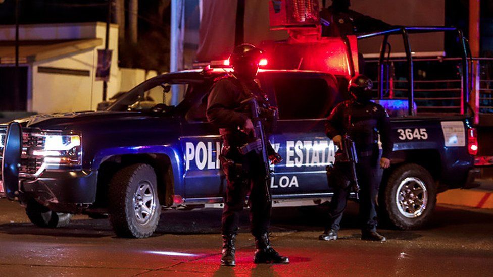 Armed Mexican police stand guard in the city of Culiacan, Sinaloa state, Mexico