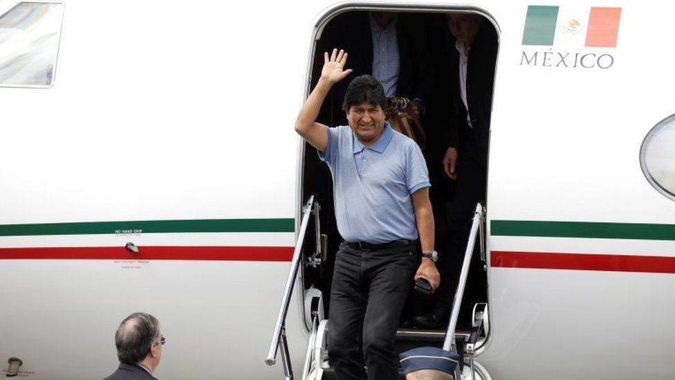 Evo Morales waves during his arrival to take asylum in Mexico, in Mexico City, Mexico, November 12, 2019