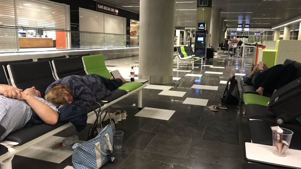 People sleeping in an airport