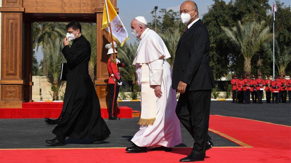 Pope Francis is welcomed by President of Iraq Barham Salih (R) during an official welcome ceremony at the Presidential palace in Baghdad, Iraq, 5 March 2021