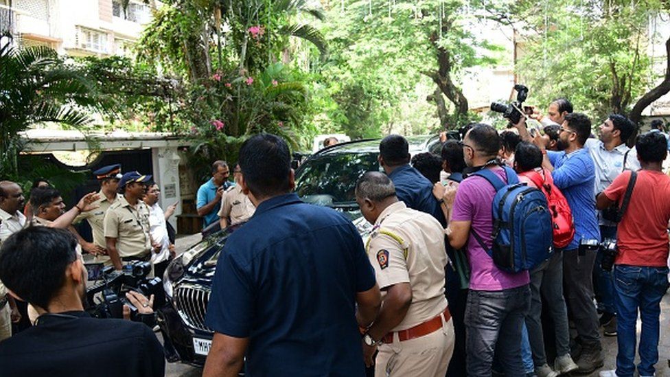 Media gather outside Bollywood actors Ranbir Kapoor and Alia Bhatt residence on the first day of their wedding ceremonies, in Mumbai on April 13, 2022.