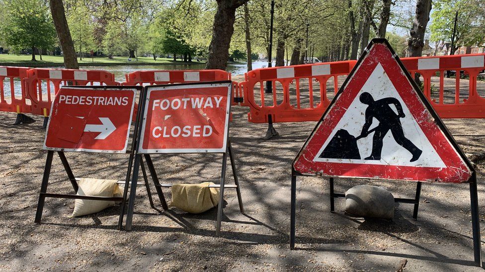 Signs saying footpath is closed on Bedford's Embankment