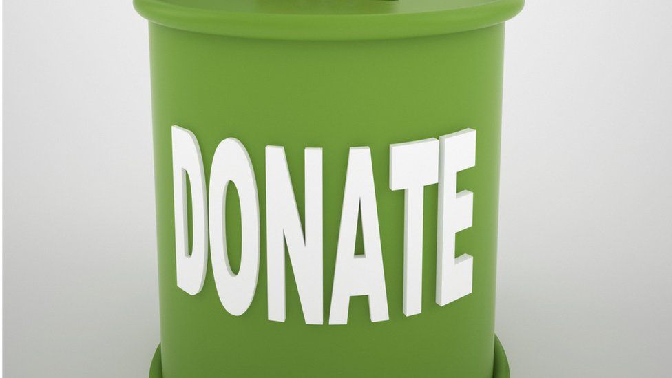 Charity tin (stock image)