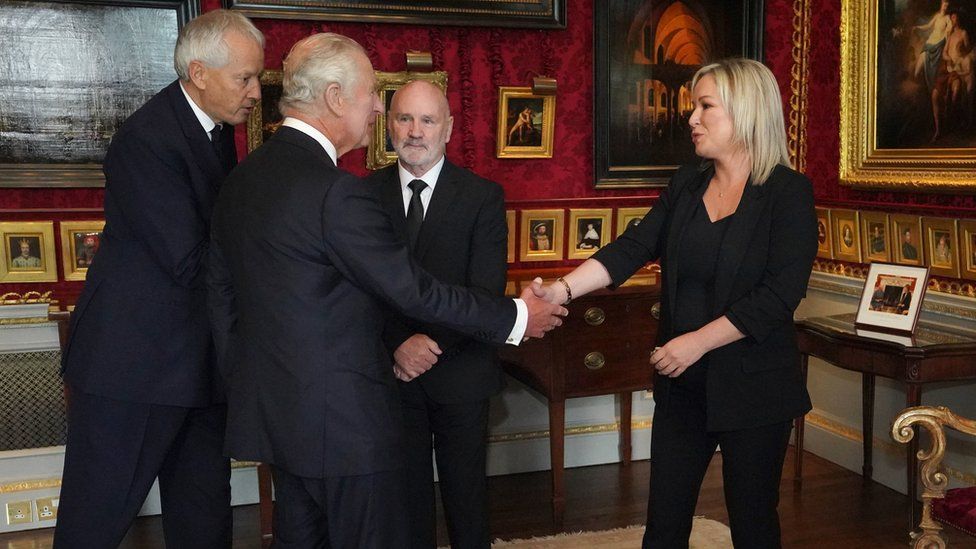 King Charles and Sinn Féin vice-president Michelle O'Neill shake hands inside Hillsborough Castle
