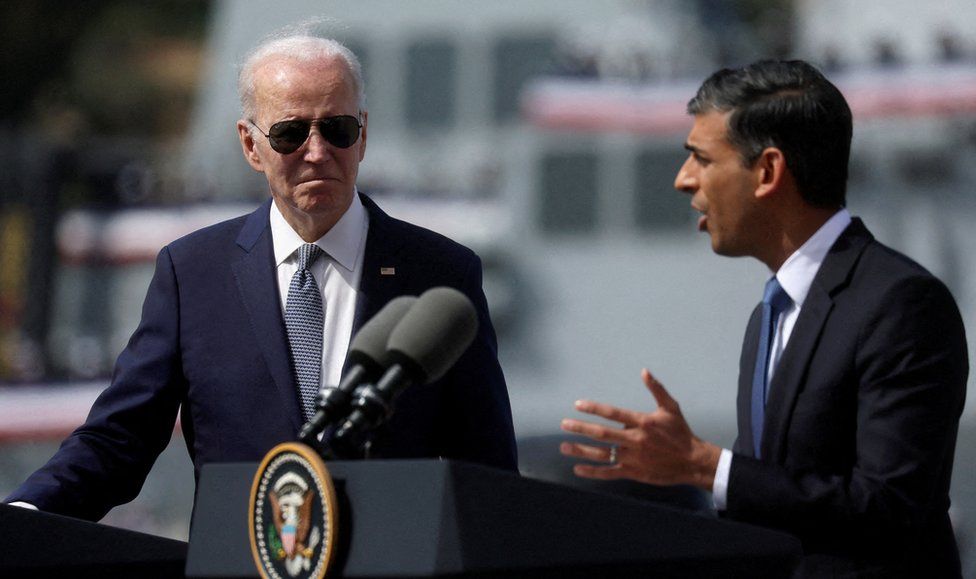 Joe Biden watches as Rishi Sunak speaks in San Diego