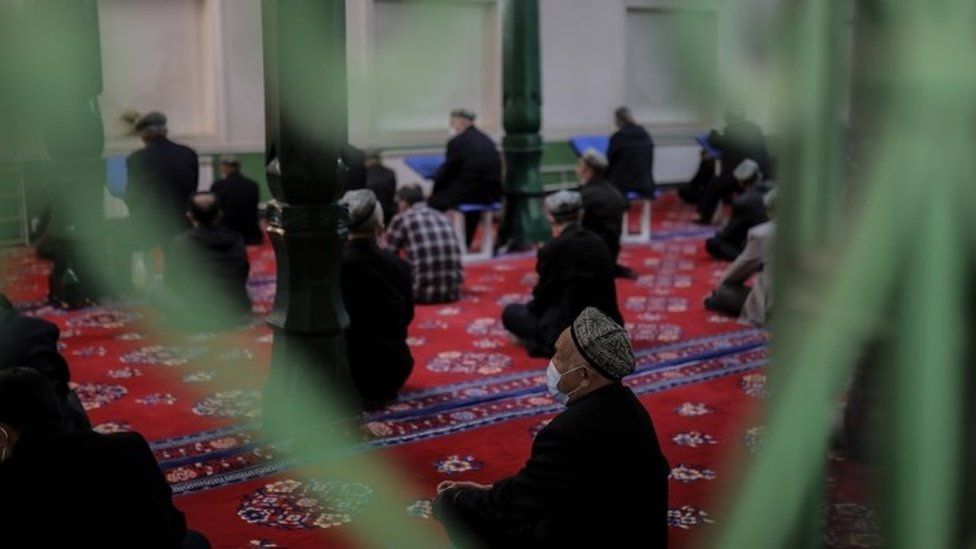 Uyghurs pray at a mosque in China's Xinjiang province