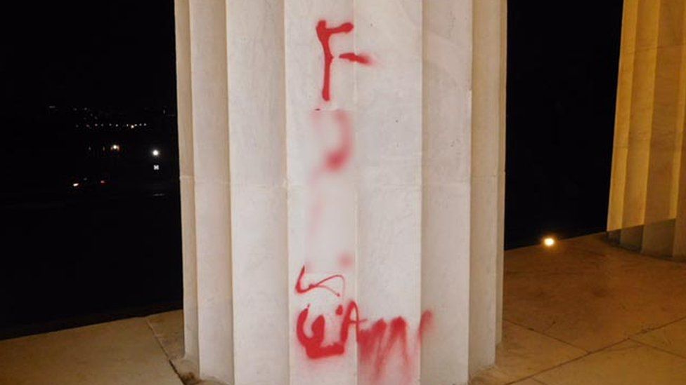 The red graffiti on a pillar
