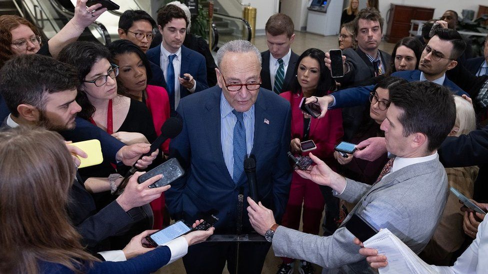 US Senate Majority Leader Chuck Schumer (C) speaks to members of the news media before the Senate failed to advance a bipartisan immigration and foreign aid bill, on Capitol Hill in Washington, DC, USA,