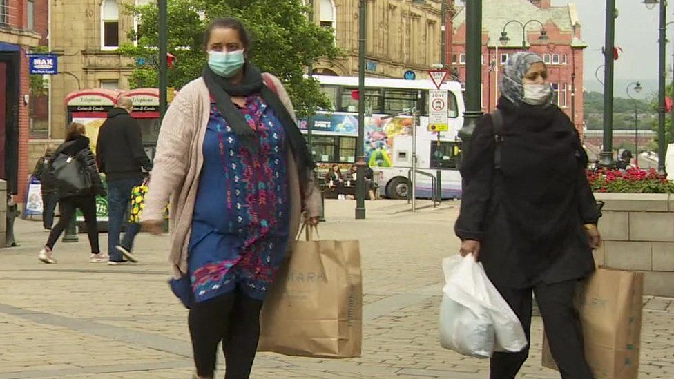 People in masks in Oldham