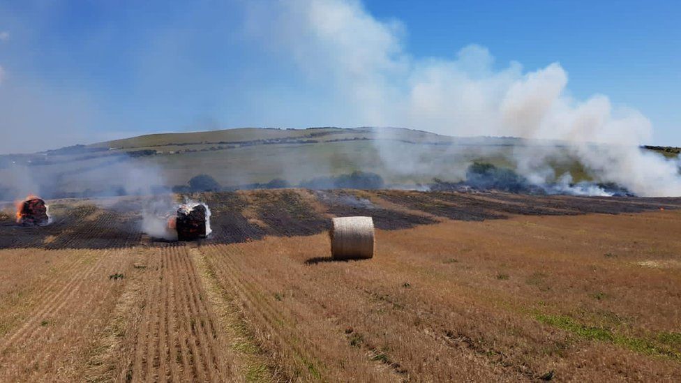 Hay bales on fire