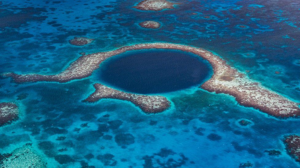 The Great Blue Hole, a submarine sinkhole in Belize Barrier Reef