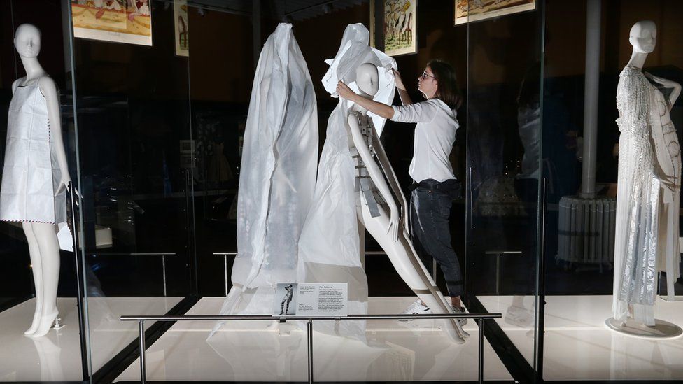 Anna Starkey, Collections Care Manager, National Museums Scotland unveils a Paco Rabanne mannequin in preparation for the reopening of the National Museum of Scotland on 19 August 2020.