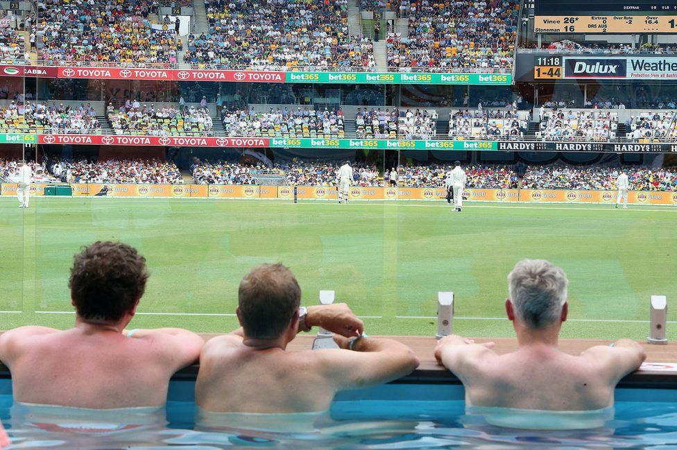 fans enjoy the pool deck on Day One of the First Test match between Australia and England at the Gabba in Brisbane