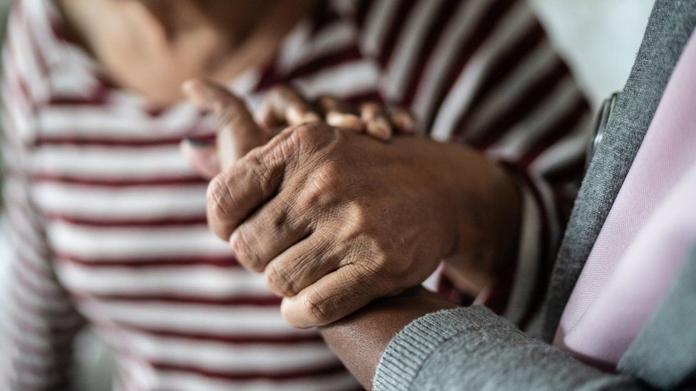 Man and woman holding hands