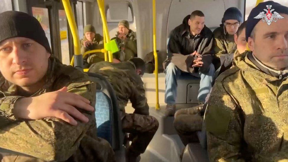 Photo purportedly showing exchanged Russian soldiers on a bus.