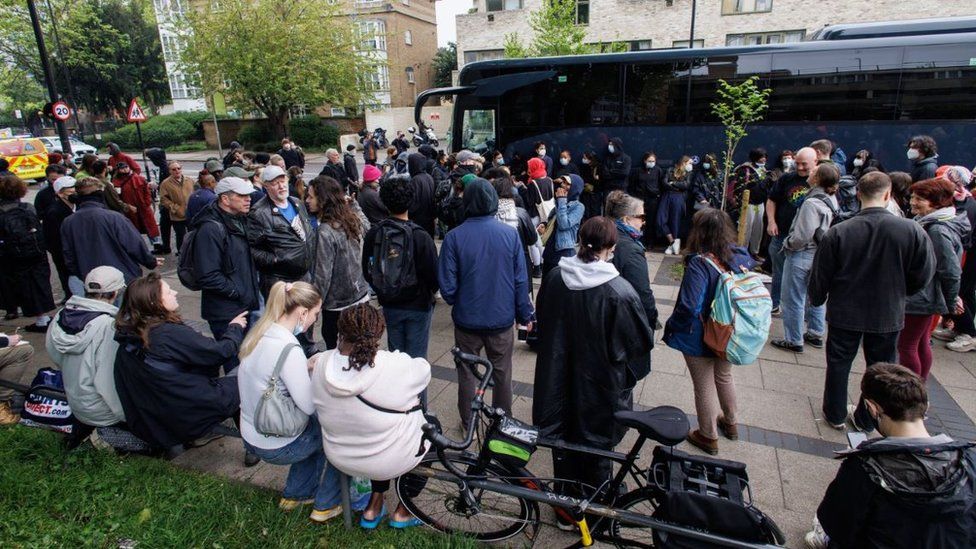 Protesters surround a bus that was due to transport asylum seekers from a hotel in Peckham