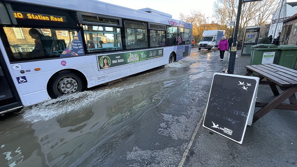 Bus driving through flood water
