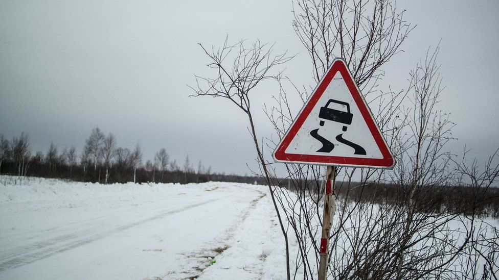 Sign warning of slippery road in Yangutum, Siberia - 2016 pic