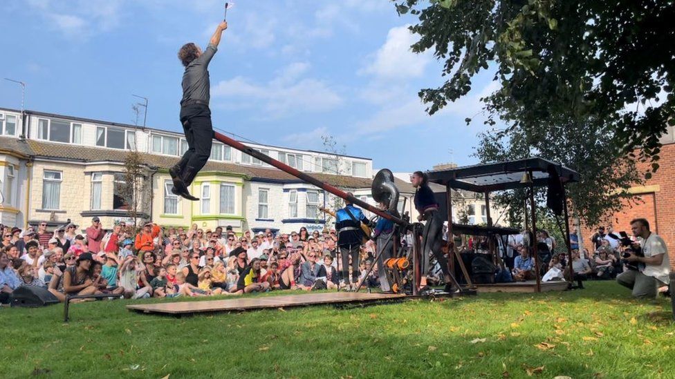 Circus act with people watching