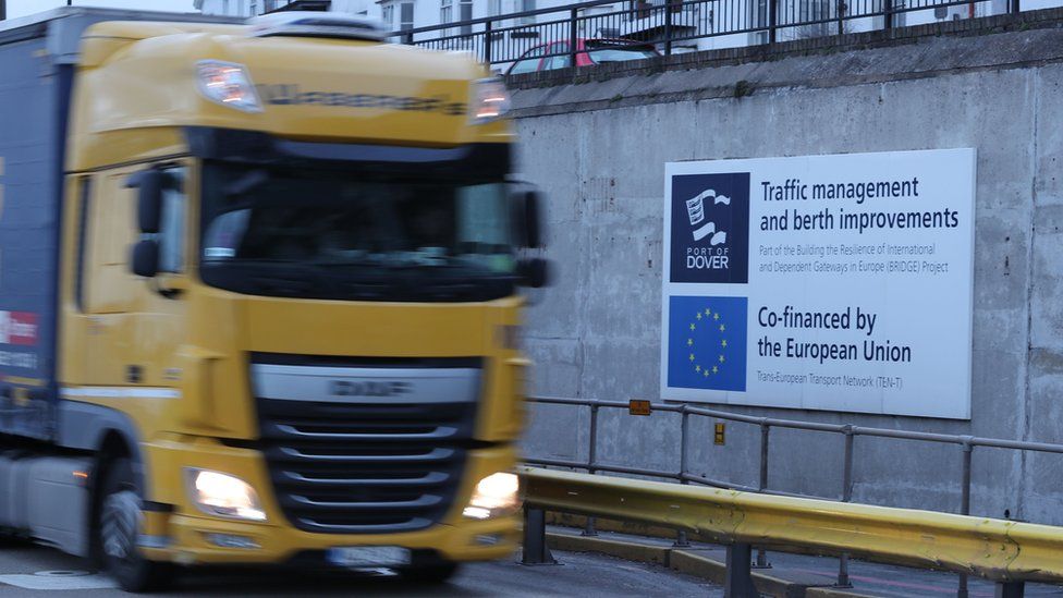 A lorry drives past an EU sign in Dover