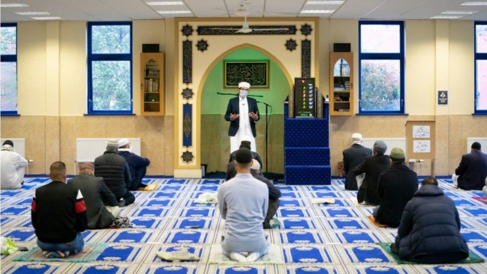 Imam Qari Asim during worship at the Makkah Masjid in Leeds