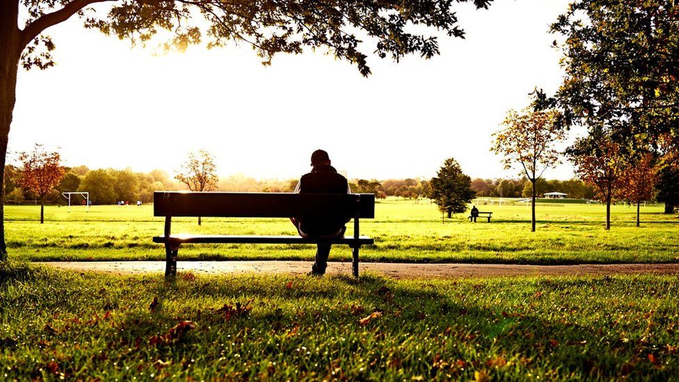 Man sitting on park bench