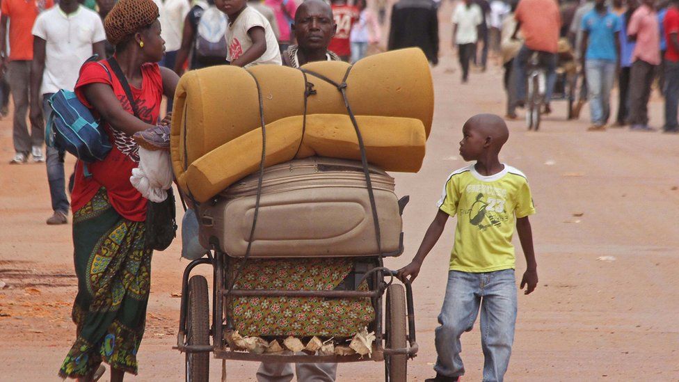 A family with their belongings on a makeshift trolley in the city of Bangui, Central African Republic, Wednesday, 30 September 2015