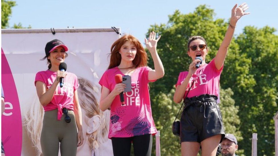Cheryl, Nicola Roberts and Nadine Coyle on stage at the Race for Life
