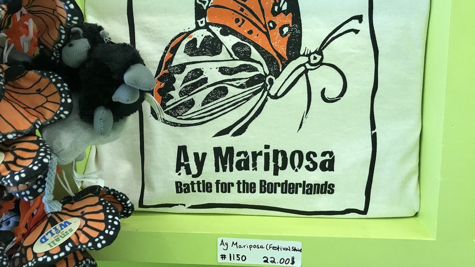 Ay Mariposa battle for borderlands shirt seen in gift shop