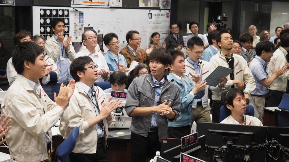 Japanese scientists celebrating