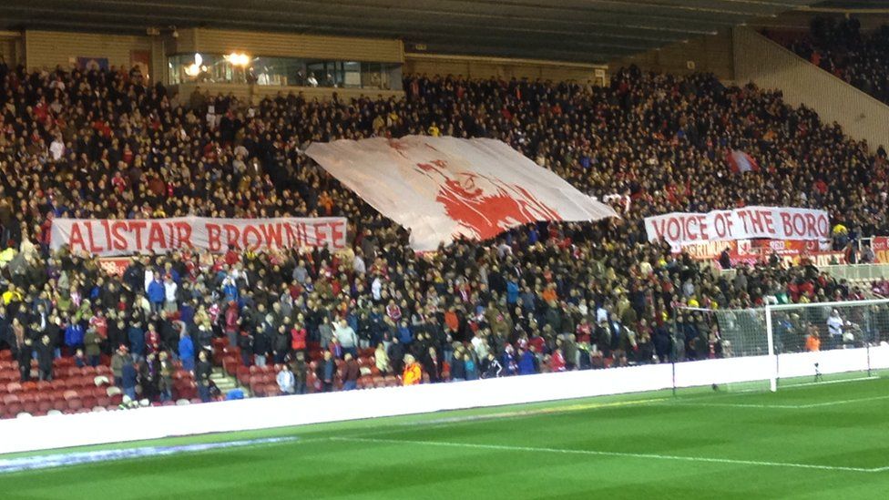 Supporters at the Riverside hold aloft banners in tribute to Ali Brownlee