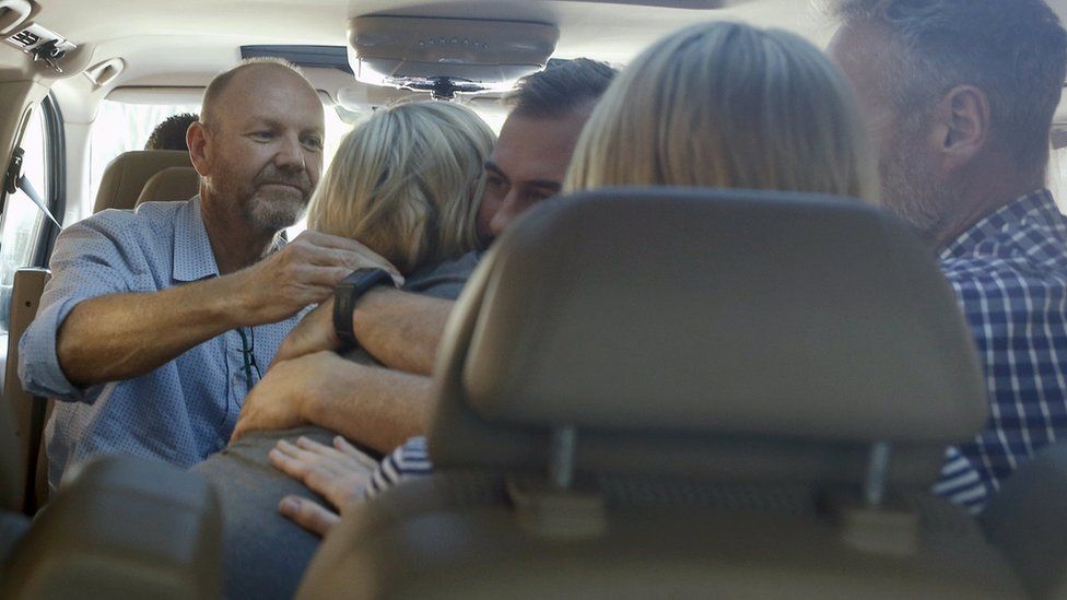 The 60 Minutes crew and Sally Faulkner embrace after their release from a Lebanese prison