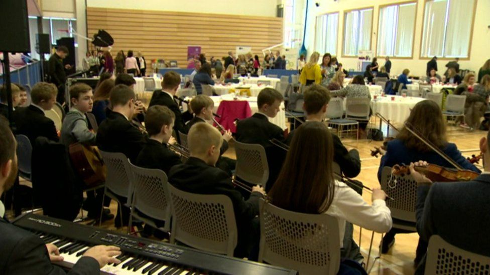 Pupils from Belfast Royal Academy and St Malachy's College share music lessons