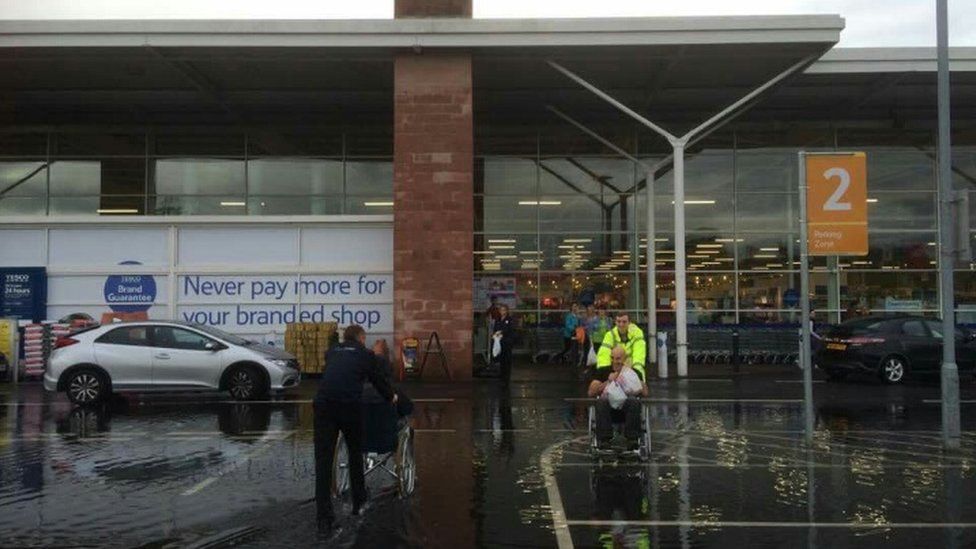 Stafford Tesco uses wheelchairs for flooded shoppers BBC News