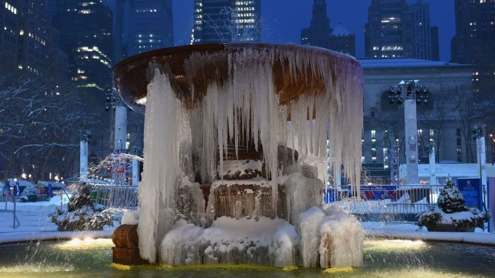 The Josephine Shaw Lowell Memorial Fountain is seen covered in ice during a winter storm on February 1, 2021 in New York City.