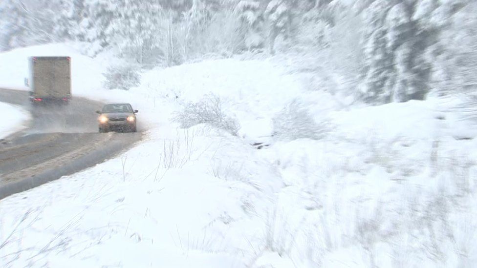 Crashed car hidden by heavy snow