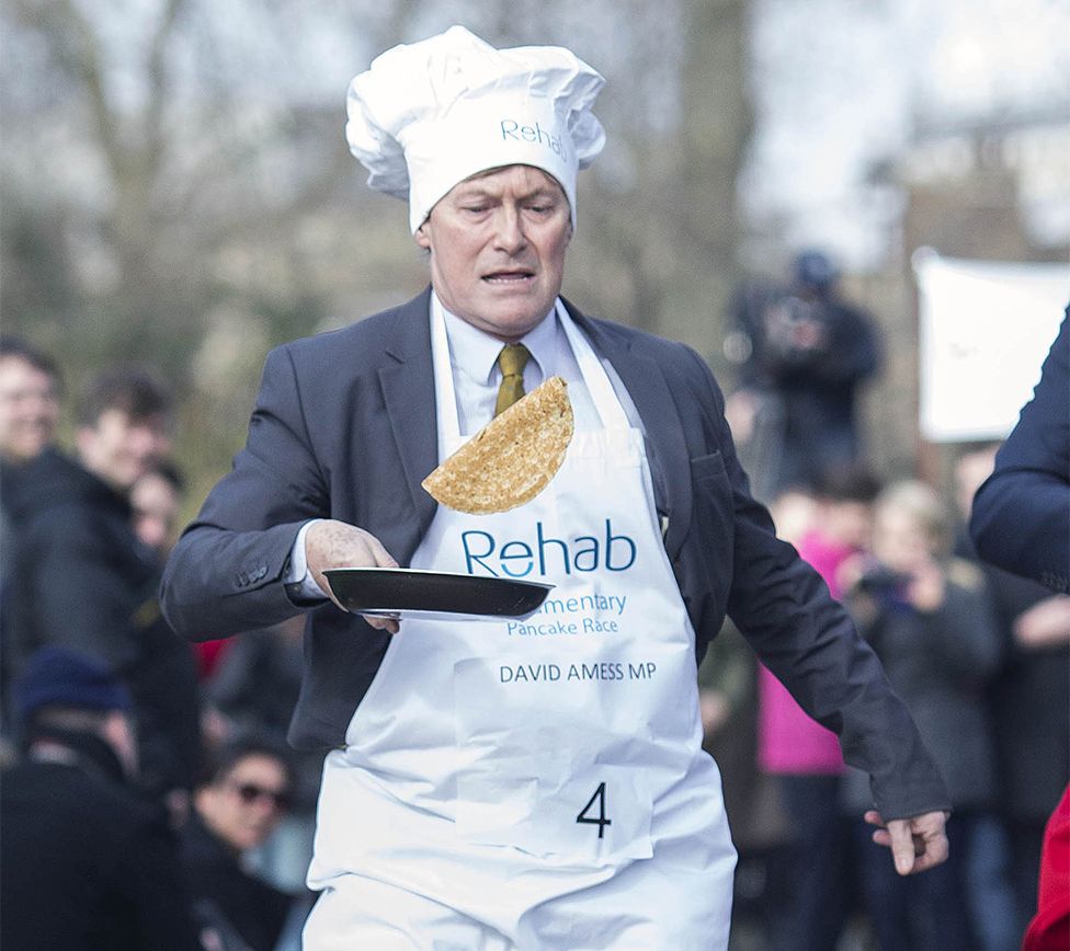 David Amess, MP for Southend West, during Rehab Parliamentary Pancake Race in Victoria Tower Gardens, Westminster, London, 4 March 2014