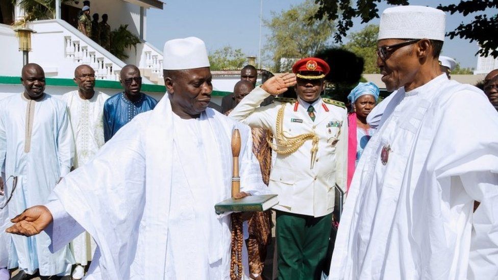 President of The Gambia Yahya Jammeh (L) welcoming President of Nigeria Muhammadu Buhari (R) at the State House in Banjul, Gambia, 13 January 2017.