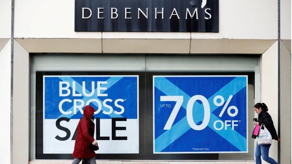 Exterior Debehmas store Stockport with Blue Cross signs