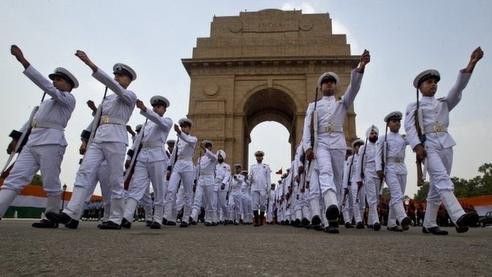 Indian soldiers leave after a ceremony to honor soldiers killed in action on occasion of 50th anniversary of India"s win over Pakistan in the war of 1965, at the India Gate war memorial in New Delhi, India, Friday, Aug. 28, 2015.