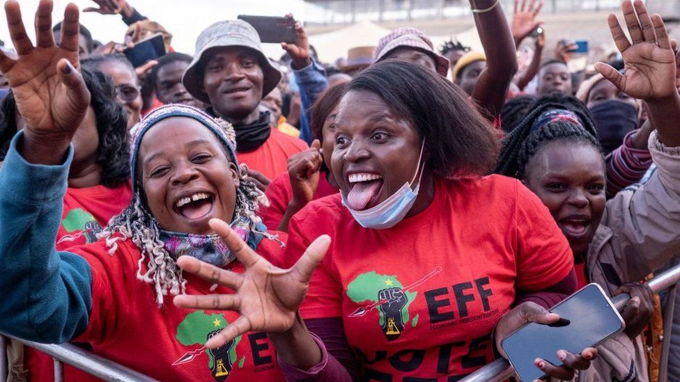 Supporters of the Economic Freedom Fighters (EFF) political party, sing and dance at the Makwarela stadium in Limpopo on June 16, 2022
